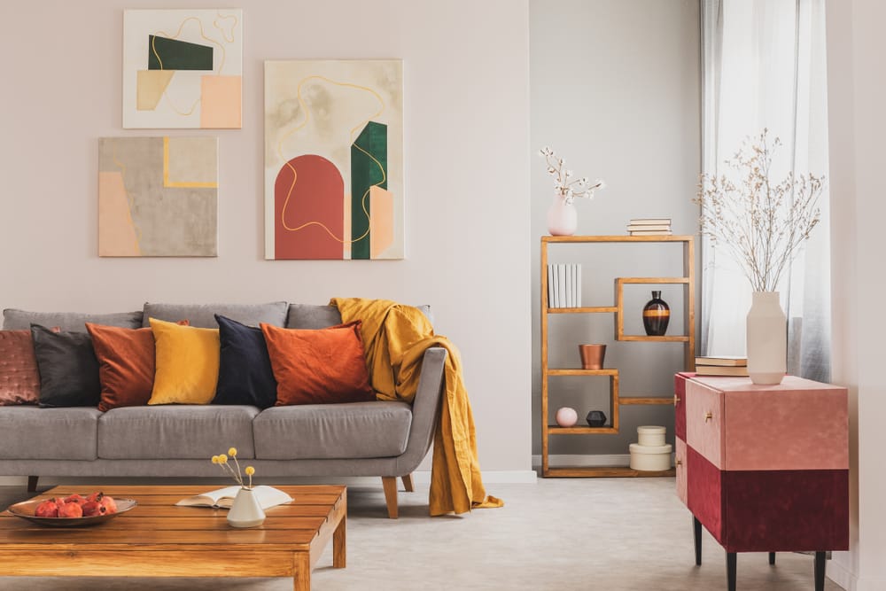 Yellow,,Orange,,Black,And,Brown,Pillows,On,Comfortable,Grey,Scandinavian